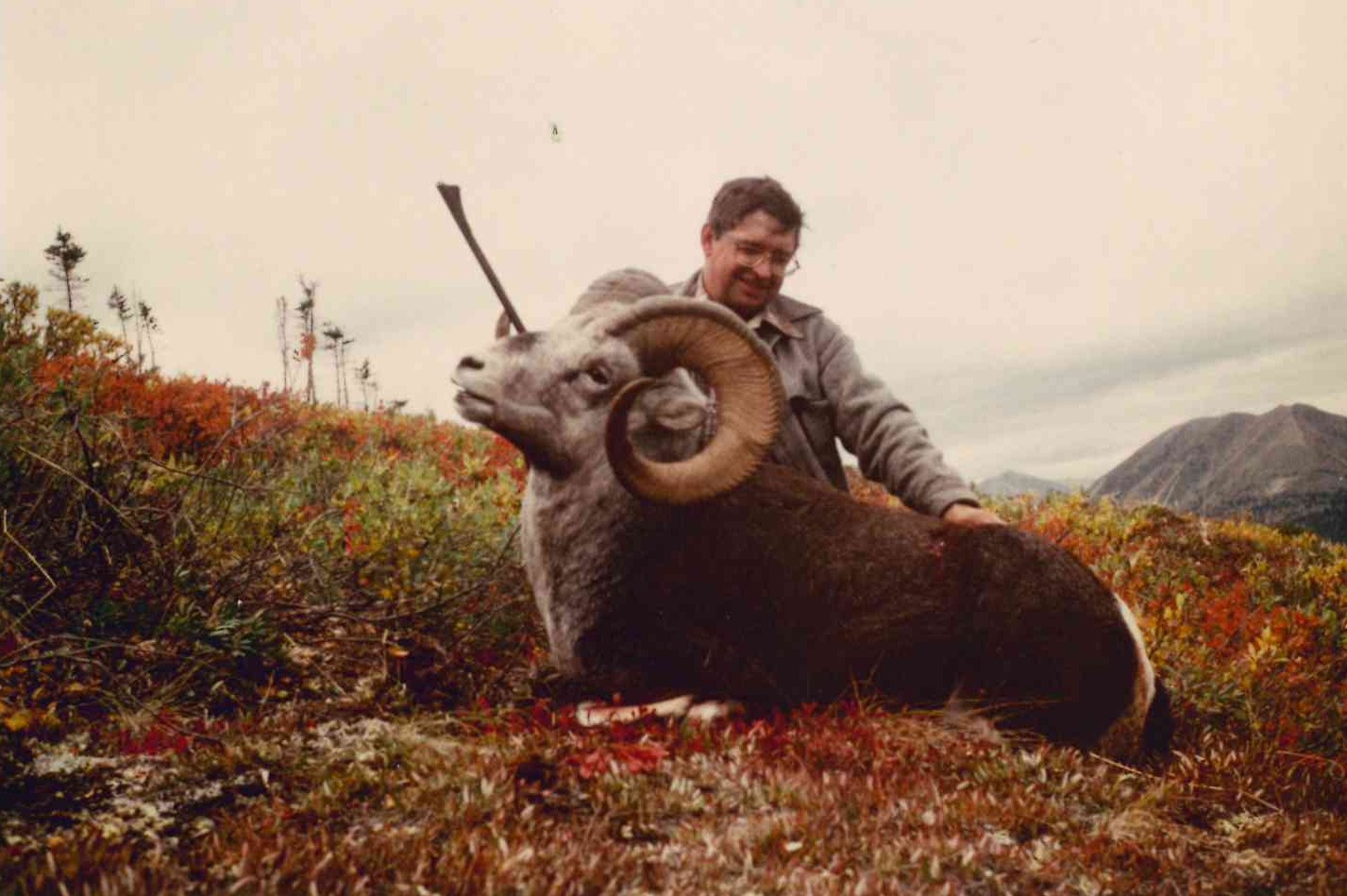 Jack, an avid sheep hunter, with a trophy bighorn ram.
